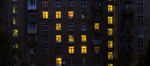 Lit up apartment buildings at night