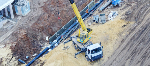 A construction site where the crew is installing underground pipes