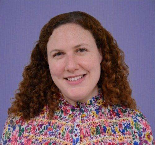 Headshot of Rachel Aland, a white woman with brown hair