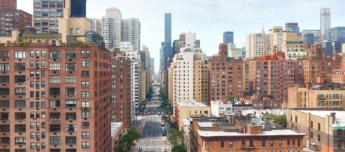 New York City skyline, featuring residential multifamily buildings