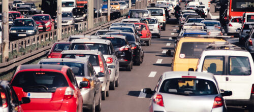 A highway with bumper-to-bumper traffic.