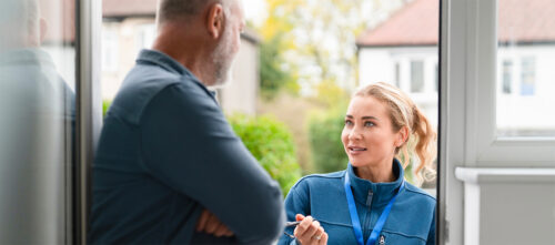 A contractor and homeowner talking about home upgrades.