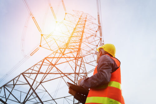 Engineering working on High-voltage tower, Check the information on paper.