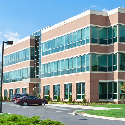An exterior shot of an office building in suburban maryland.
