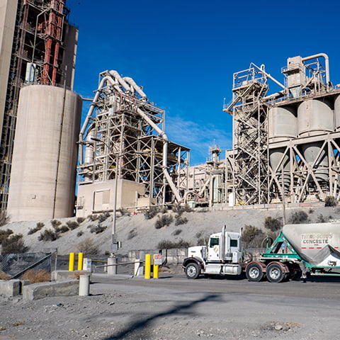 A tuck in front of a concrete production facility