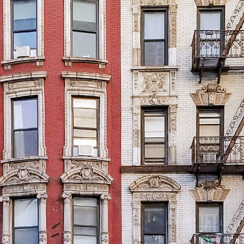 Exterior of a red and white brick apartment buliding