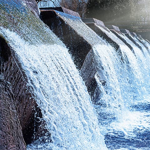 Clean water flows out of a water treatment plant