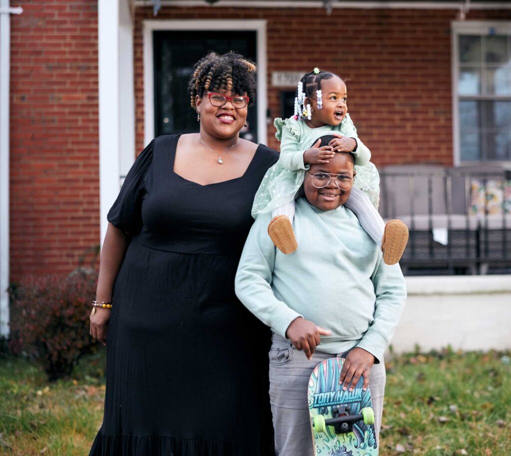 GHHI_thumbnail_Lambert-Family-in-front-of-home